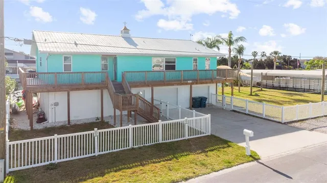 a view of a balcony with two chairs