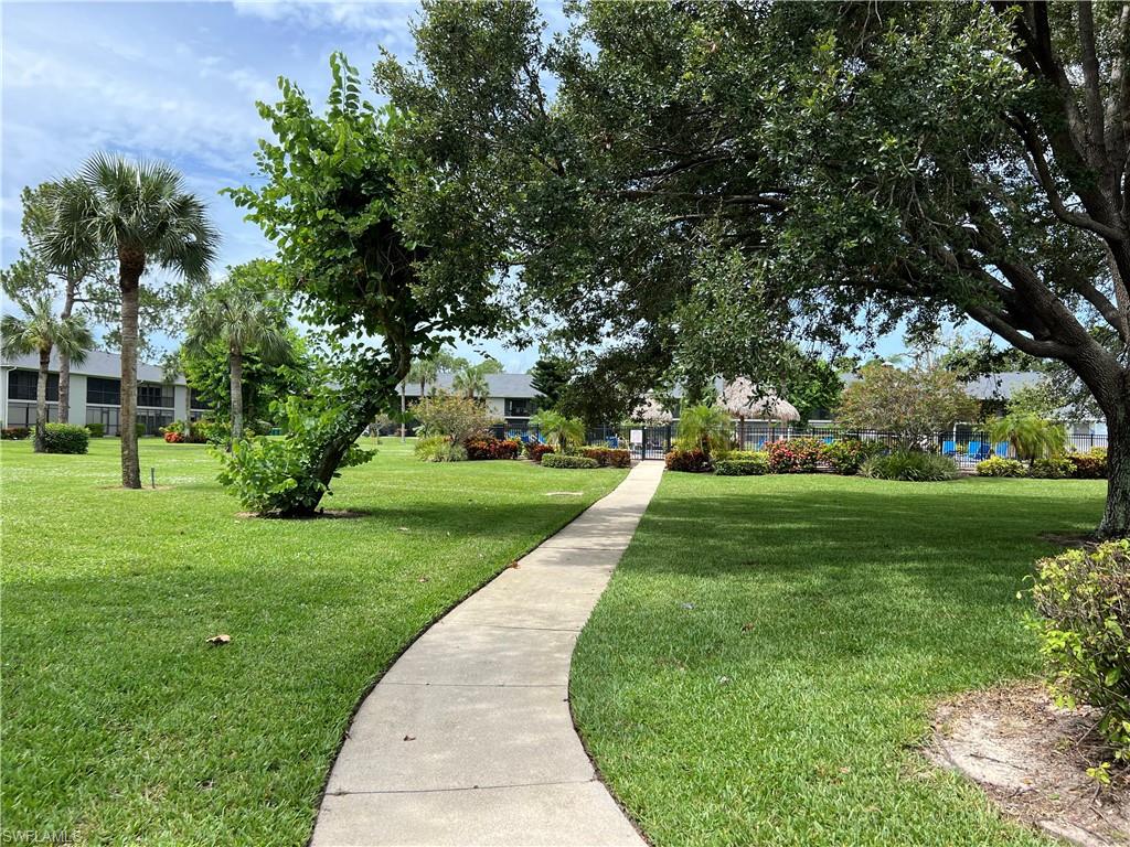 Undisclosed Address Naples, FL 34116 - Photo 10 of 14 a view of a park with large trees