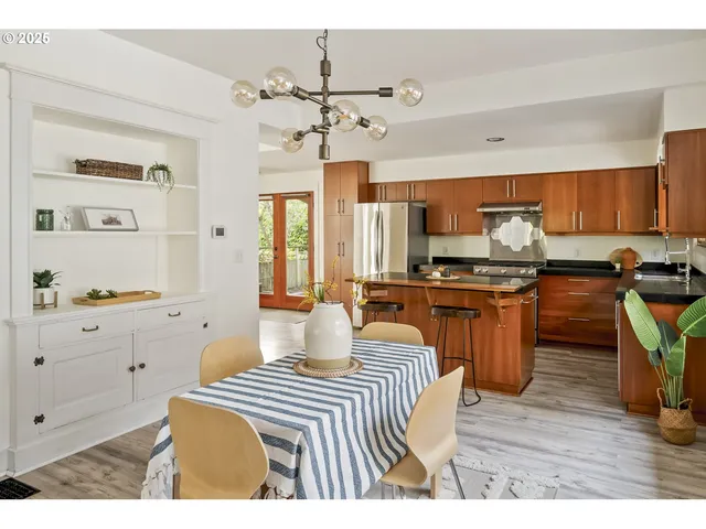 a kitchen with a sink appliances and cabinets