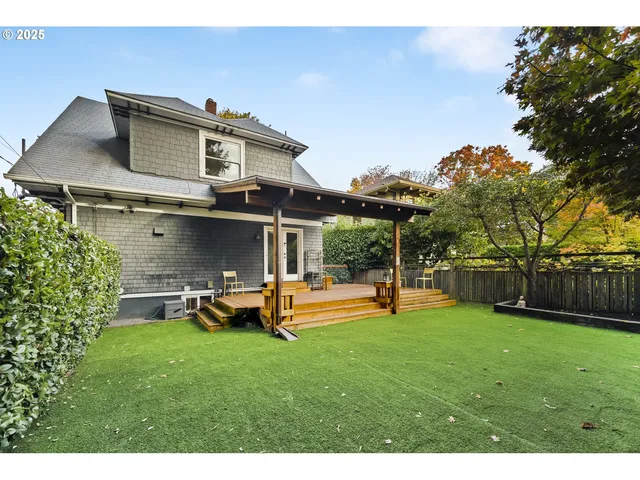 a view of a house with a backyard patio and swimming pool