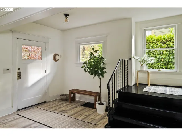 a view of a livingroom with furniture and a window