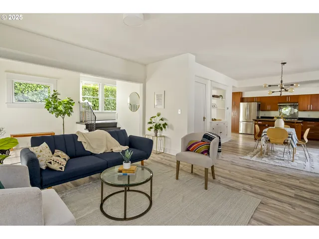 a living room with furniture and a table