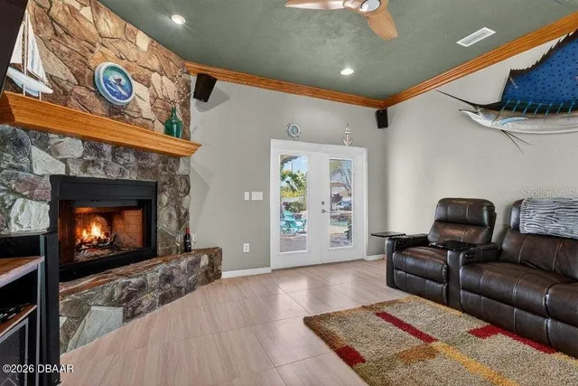 a living room with furniture and a fireplace
