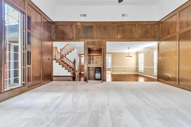 a kitchen with granite countertop a sink cabinets stainless steel appliances and a counter space
