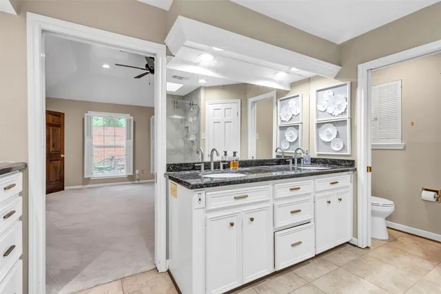 an aerial view of a house with garden space and lake view
