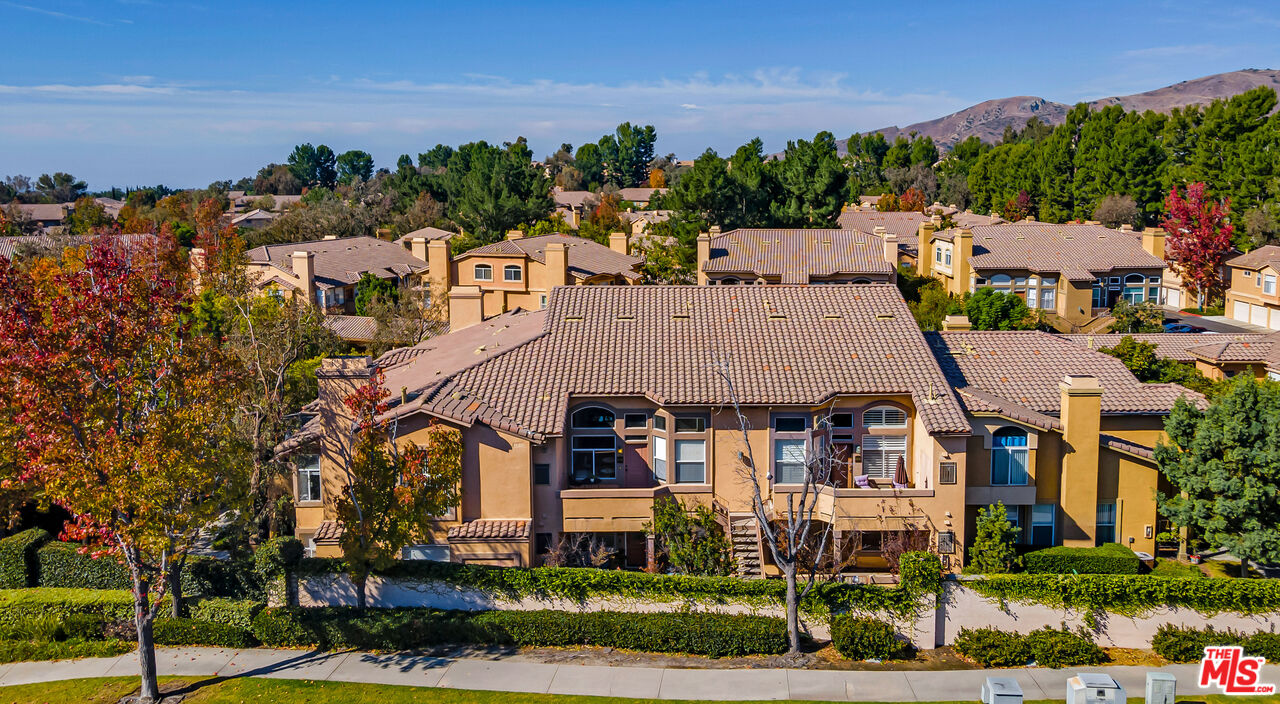 19431 Rue De Valore, Unit 41M Foothill Ranch, CA 92610 - Photo 18 of 23 front view of a house with a yard