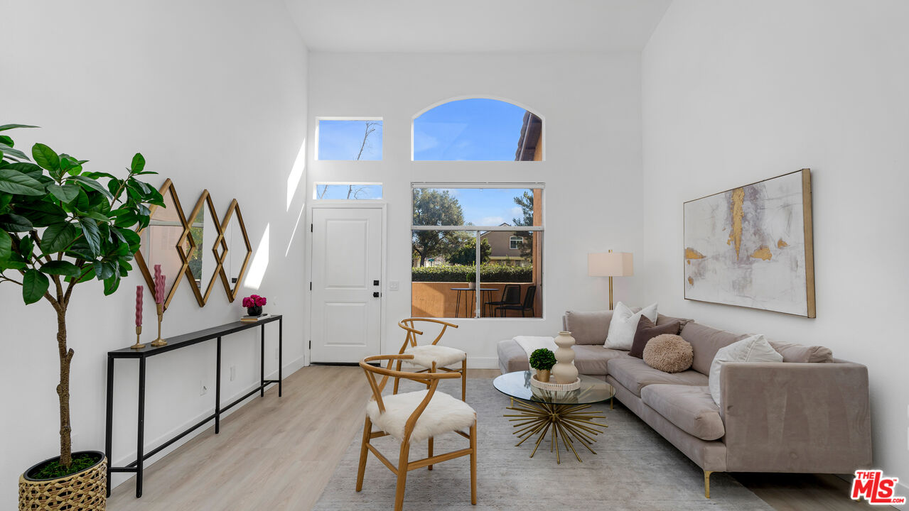 19431 Rue De Valore, Unit 41M Foothill Ranch, CA 92610 - Photo 2 of 23 a living room with furniture a window and a potted plant
