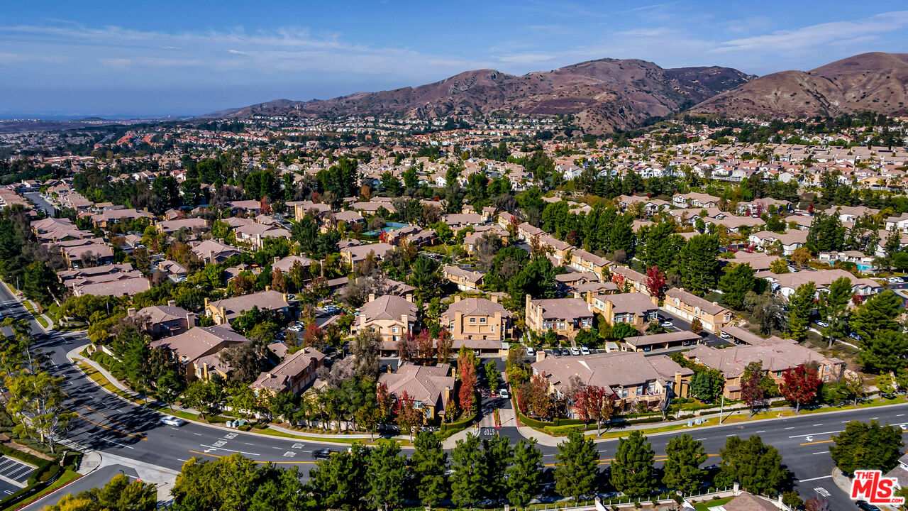 19431 Rue De Valore, Unit 41M Foothill Ranch, CA 92610 - Photo 23 of 23 an aerial view of residential houses with outdoor space and trees