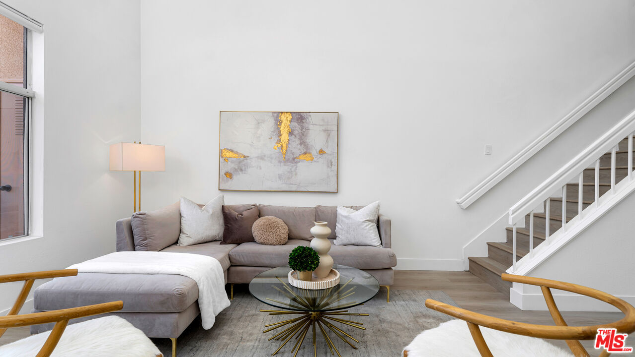 19431 Rue De Valore, Unit 41M Foothill Ranch, CA 92610 - Photo 3 of 23 a living room with furniture and a lamp