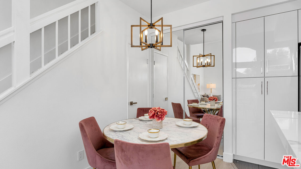 19431 Rue De Valore, Unit 41M Foothill Ranch, CA 92610 - Photo 6 of 23 a dining room with furniture and wooden floor