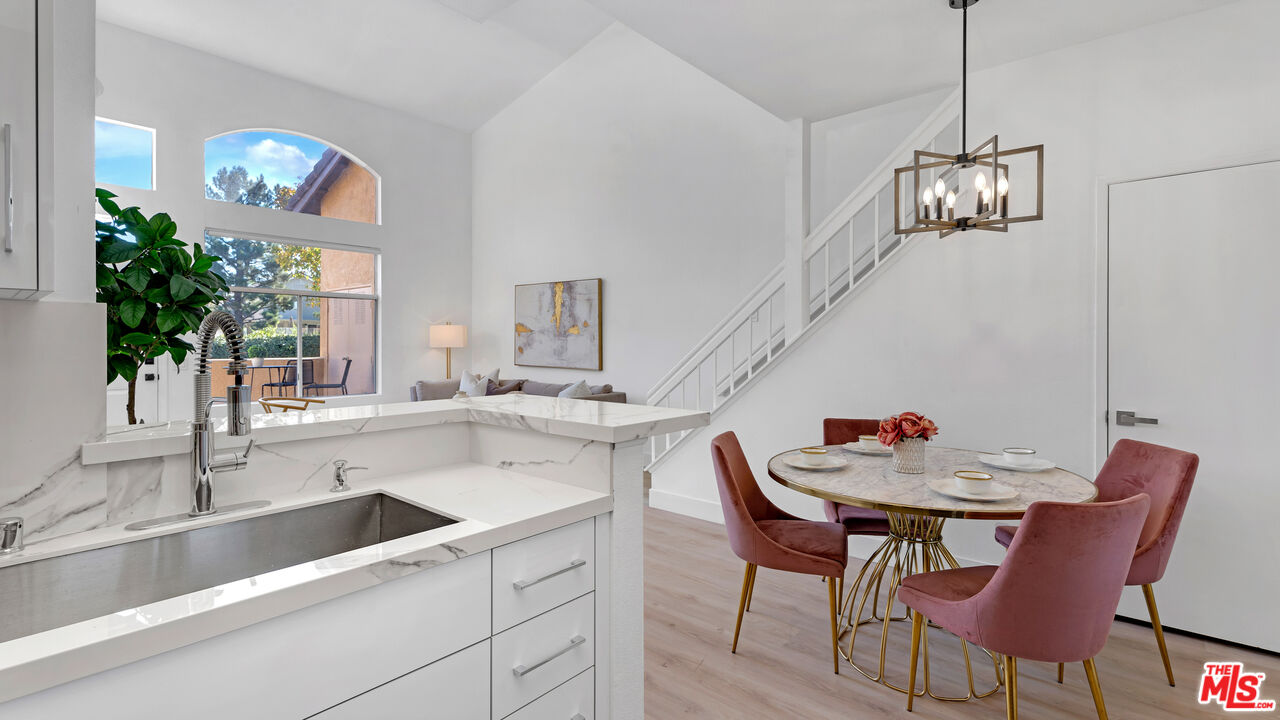 19431 Rue De Valore, Unit 41M Foothill Ranch, CA 92610 - Photo 9 of 23 a view of a dining room and chandelier