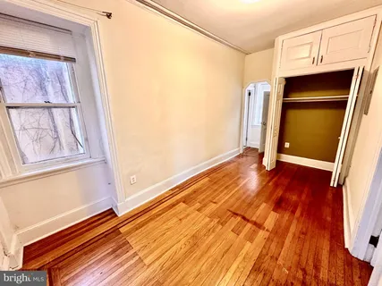 a view of front door with wooden floor