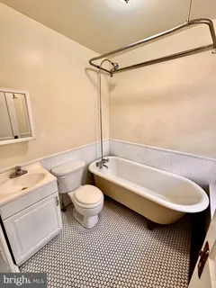 a bathroom with a sink toilet a shower and a bathtub