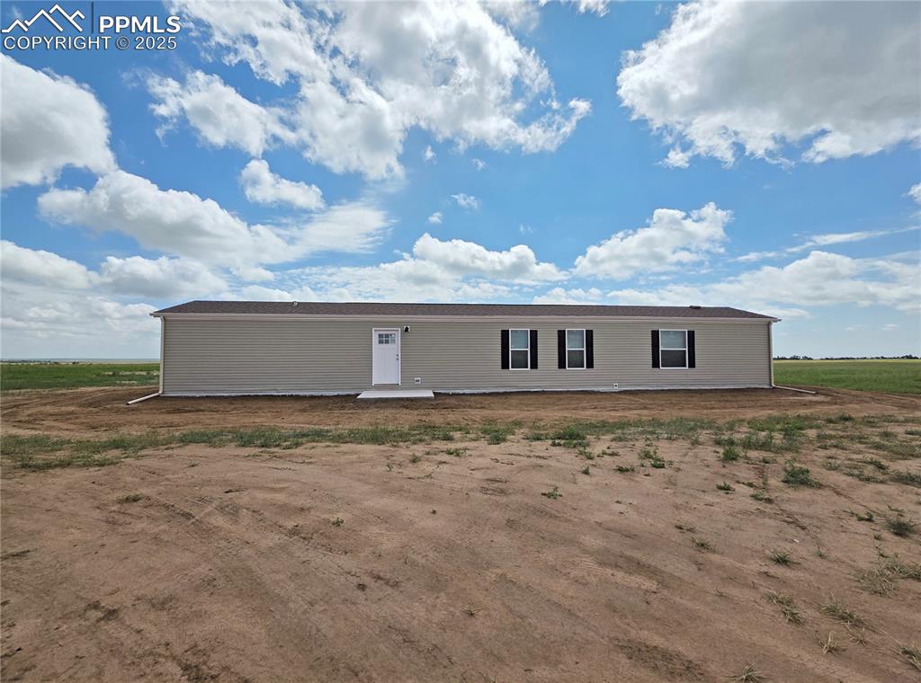6685 Ramah Highway Yoder, CO 80864 - Photo 1 of 30 a view of a house with a yard