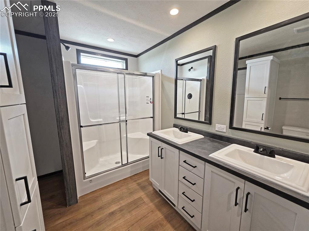 6685 Ramah Highway Yoder, CO 80864 - Photo 18 of 30 a bathroom with a granite countertop sink mirror and double