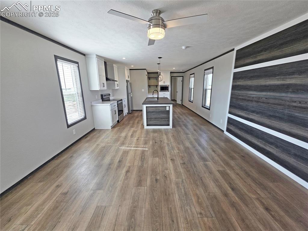6685 Ramah Highway Yoder, CO 80864 - Photo 8 of 30 a view of a livingroom with wooden floor and furniture