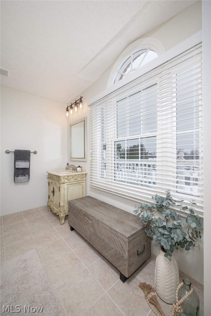 3912 Raintree Circle Uniontown, OH 44685 - Photo 28 of 49 Bathroom featuring vanity and light tile patterned flooring