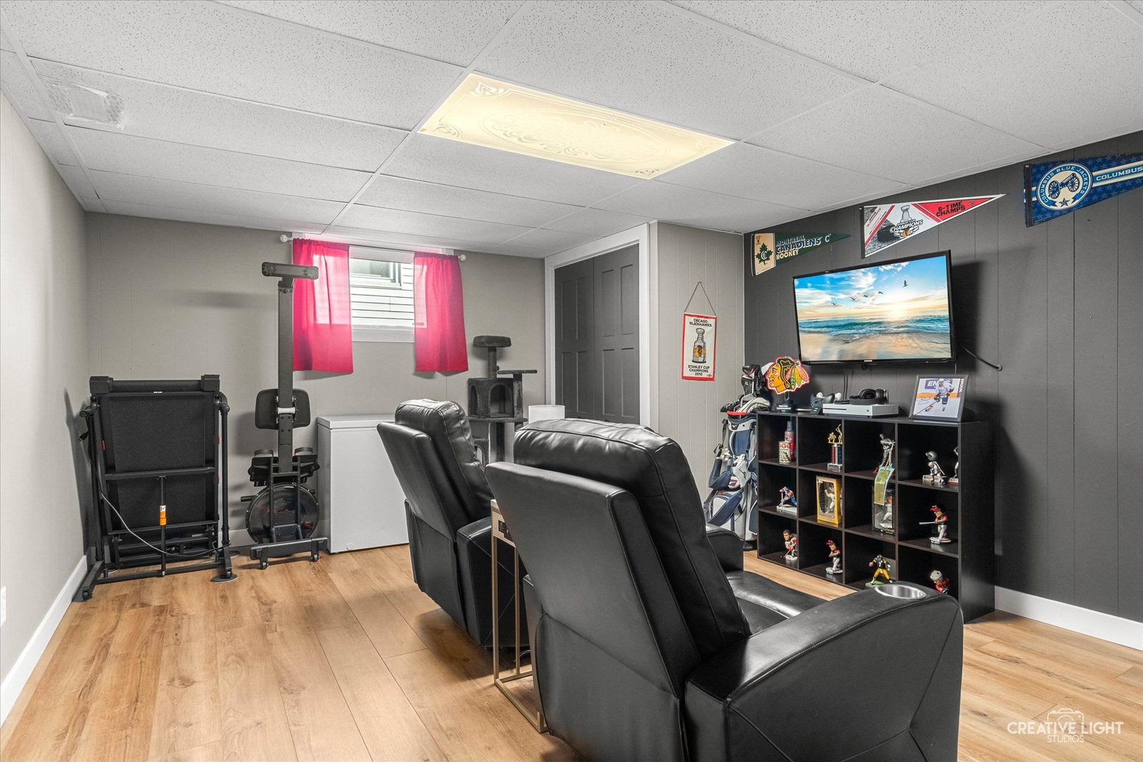 545 Gordon Drive Crete, IL 60417 - Photo 17 of 24 a room with furniture a flat screen tv and gym equipment