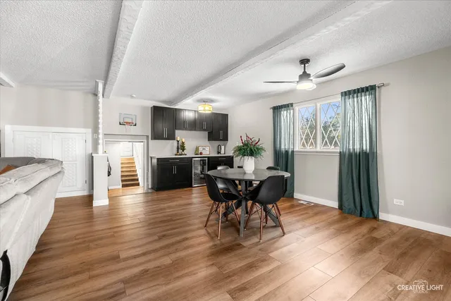 a view of a dining room with furniture window and wooden floor