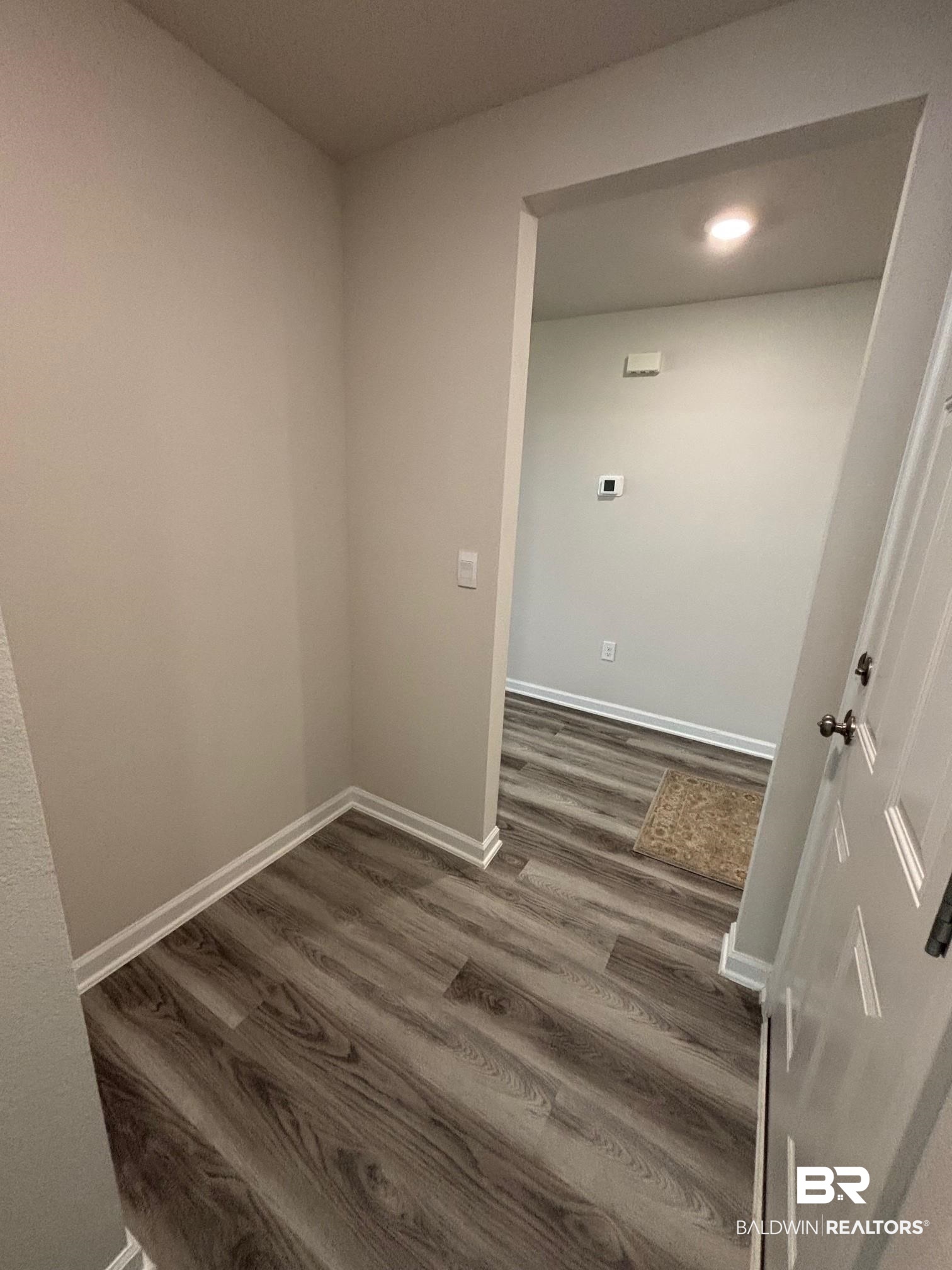 22215 Aleutian Avenue Foley, AL 36535 - Photo 18 of 34 Laundry area with dark hardwood / wood-style flooring