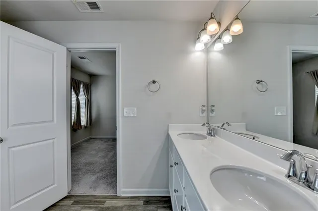 a bathroom with bathtub and window