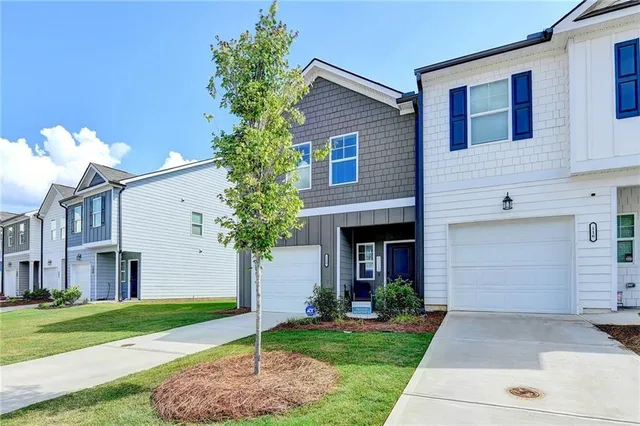 a front view of a house with garden