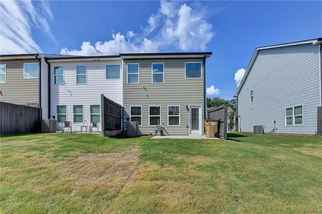 a view of a house with a backyard