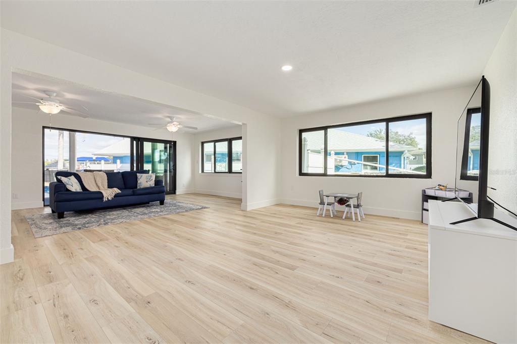 5531 Manatee Point Drive New Port Richey, FL 34652 - Photo 12 of 61 a living room with furniture and a large window