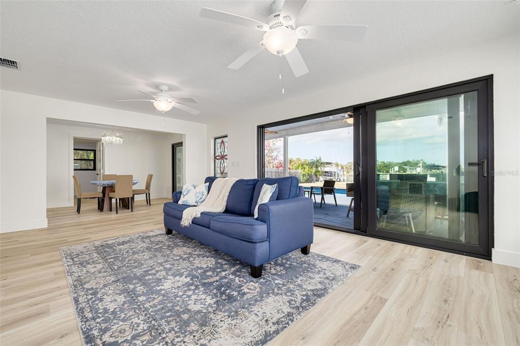 5531 Manatee Point Drive New Port Richey, FL 34652 - Photo 13 of 61 a living room with furniture and a large window