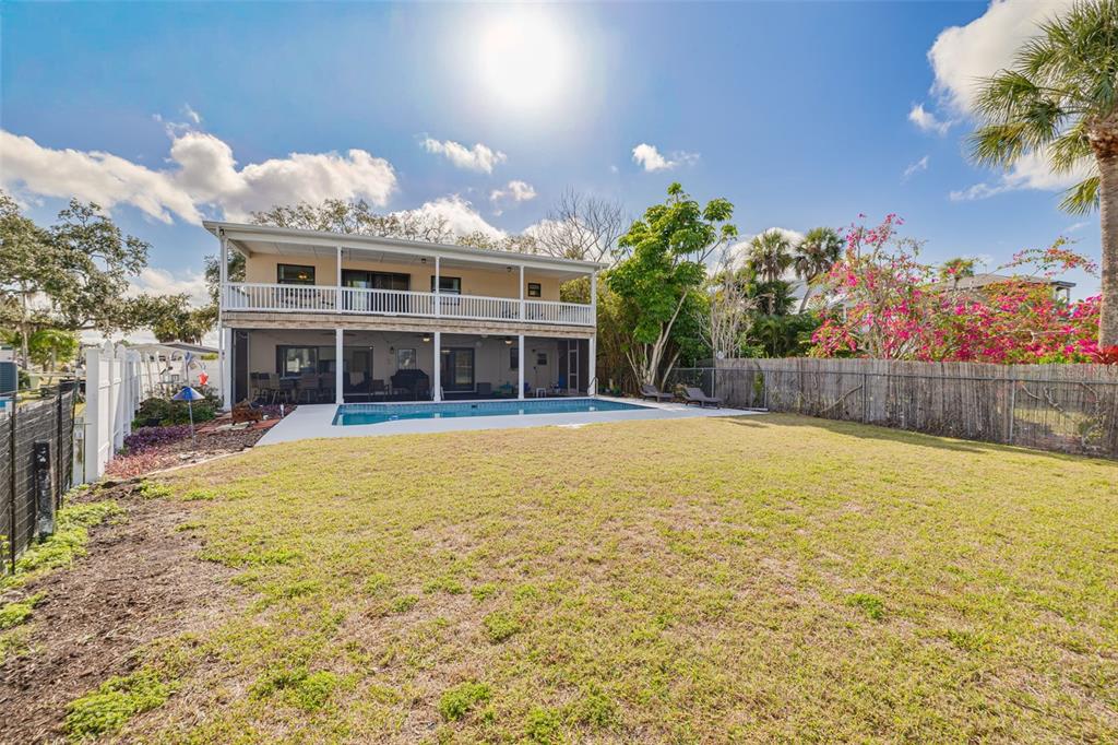 5531 Manatee Point Drive New Port Richey, FL 34652 - Photo 21 of 61 a view of a house with a swimming pool