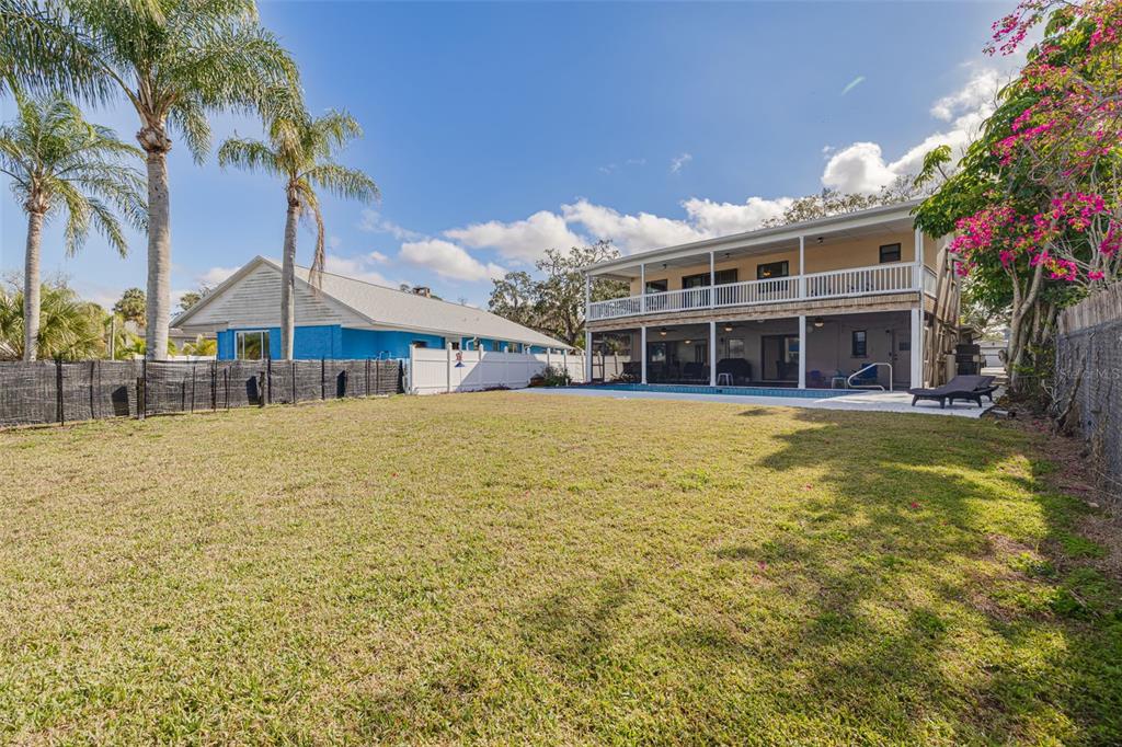 5531 Manatee Point Drive New Port Richey, FL 34652 - Photo 22 of 61 a view of a house with a swimming pool