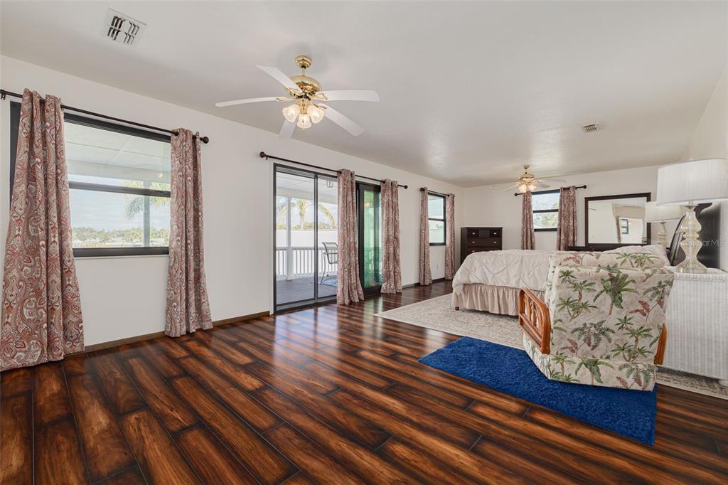 5531 Manatee Point Drive New Port Richey, FL 34652 - Photo 27 of 61 a living room with furniture and wooden floor
