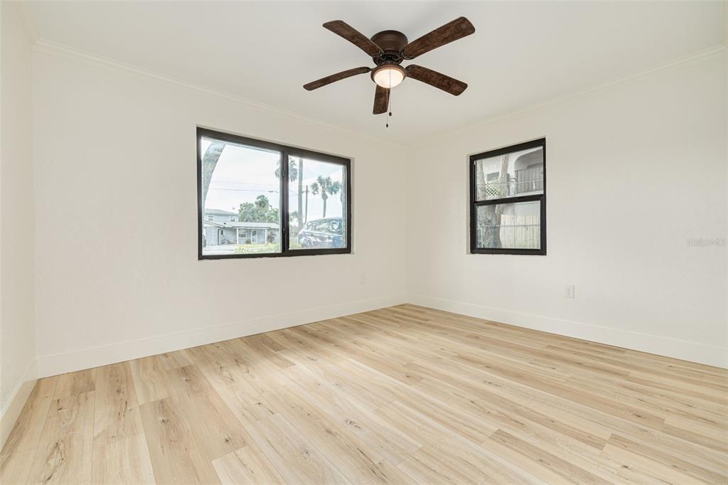5531 Manatee Point Drive New Port Richey, FL 34652 - Photo 46 of 61 a view of an empty room with wooden floor and a window