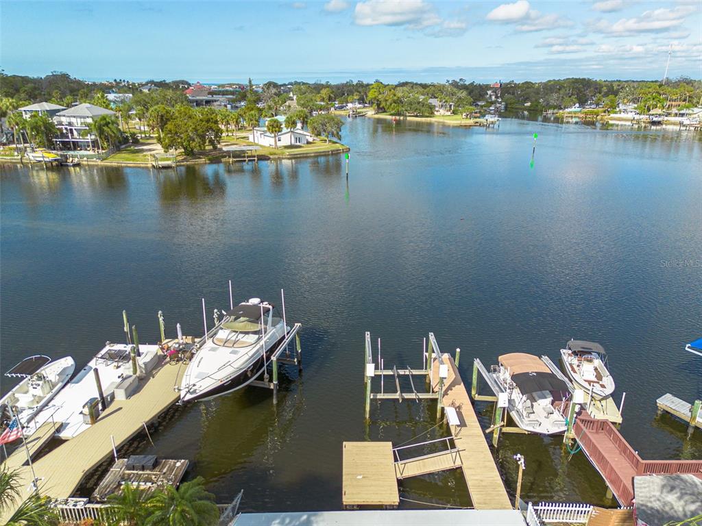 5531 Manatee Point Drive New Port Richey, FL 34652 - Photo 5 of 61 a view of a lake with boats and trees in the background
