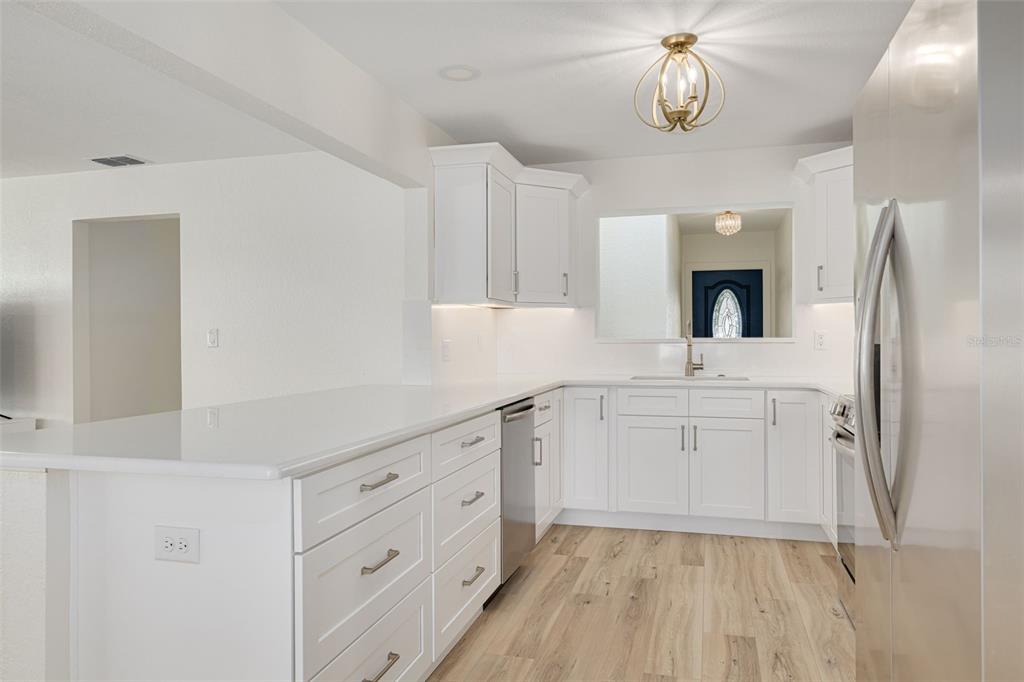 5531 Manatee Point Drive New Port Richey, FL 34652 - Photo 6 of 61 a spacious bathroom with a sink a mirror and a vanity