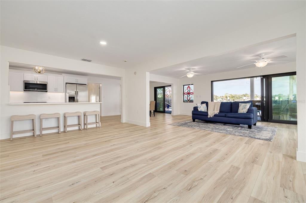 5531 Manatee Point Drive New Port Richey, FL 34652 - Photo 10 of 61 a living room with furniture and a wooden floor