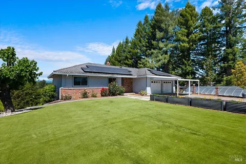 a view of a yard with an outdoor space