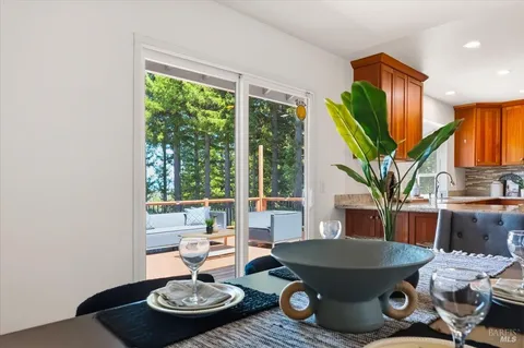 a bathroom with a shower sink vanity and toilet