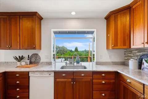 a view of a room with wooden floor and window