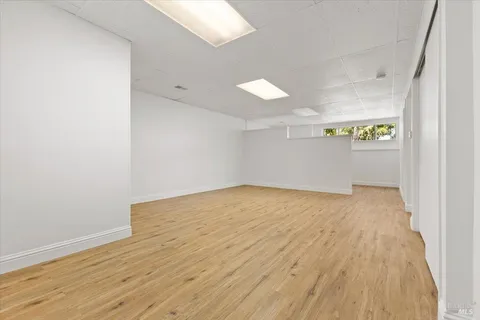 a bathroom with a sink toilet and a mirror