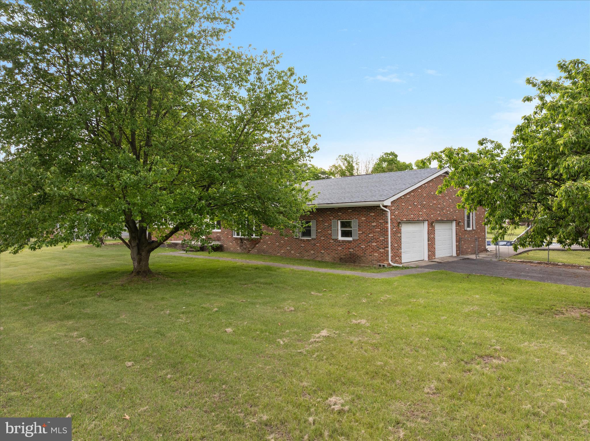 64 Shickle Lane Inwood, WV 25428 - Photo 36 of 42 a front view of a house with garden
