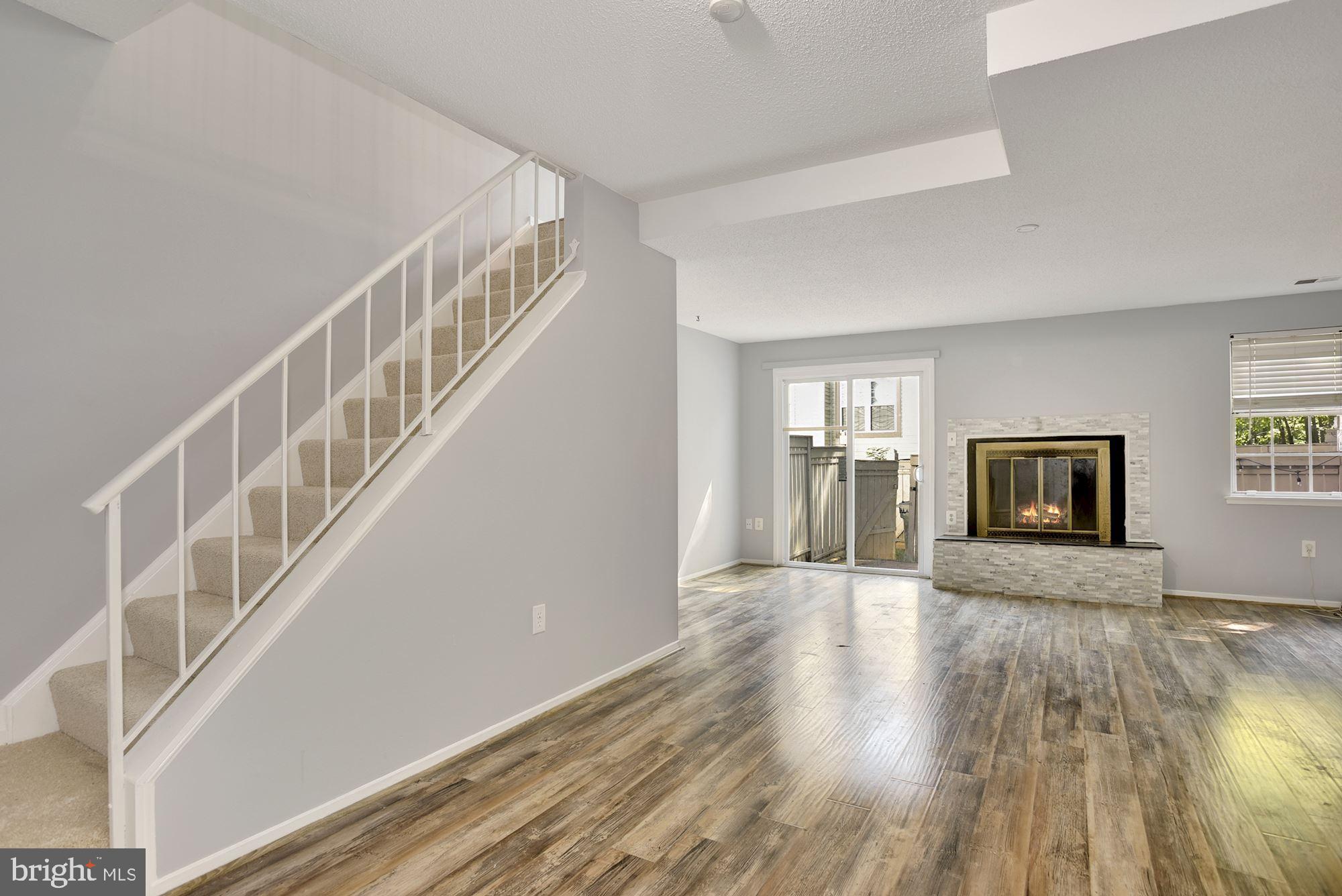 2351 Hunters Square Court Reston, VA 20191 - Photo 23 of 29 Fireplace and sliding glass doors