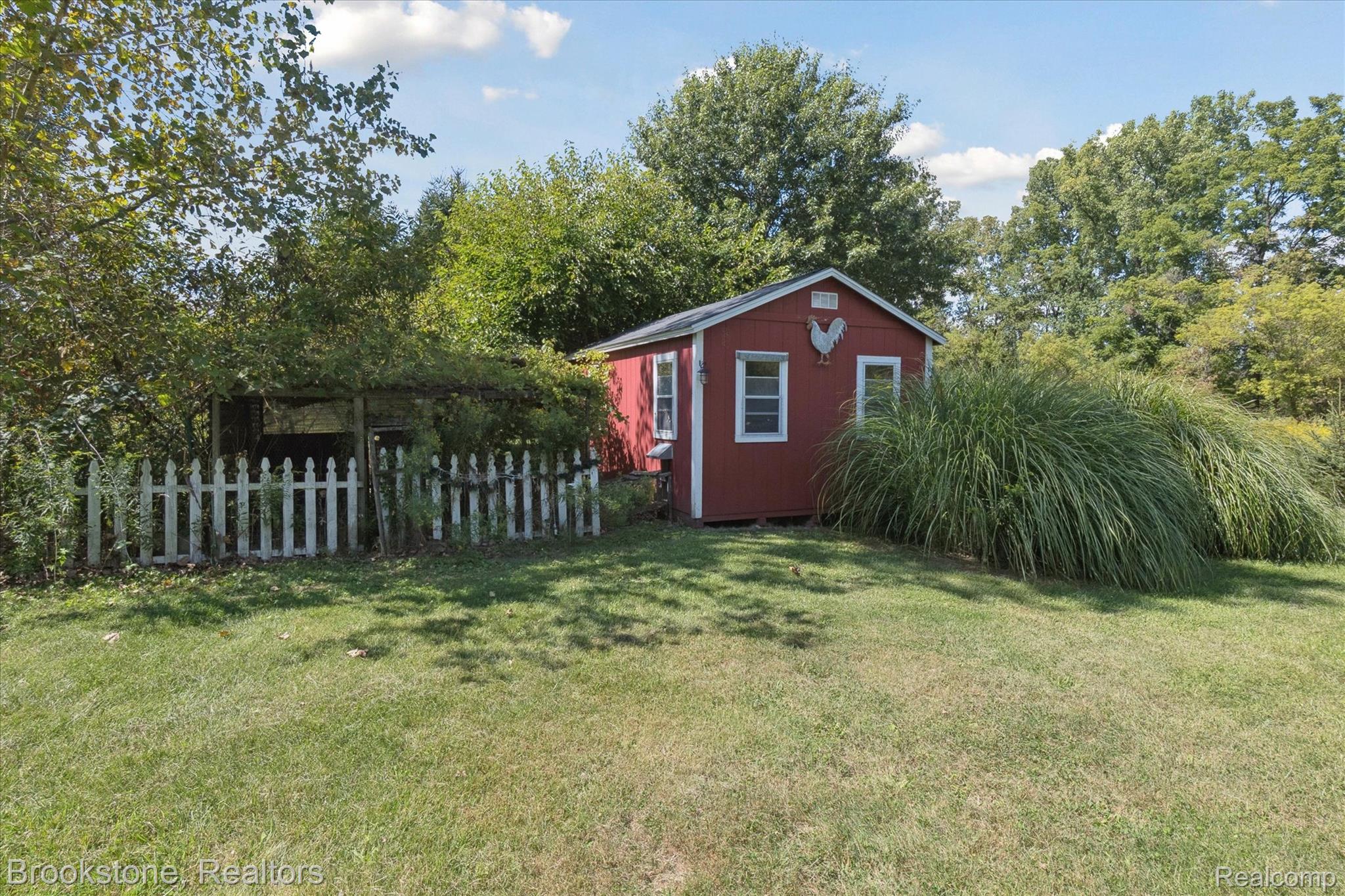 13962 South Beardslee Road Perry, MI 48872 - Photo 47 of 56 View of yard featuring an outbuilding and view of wooded area