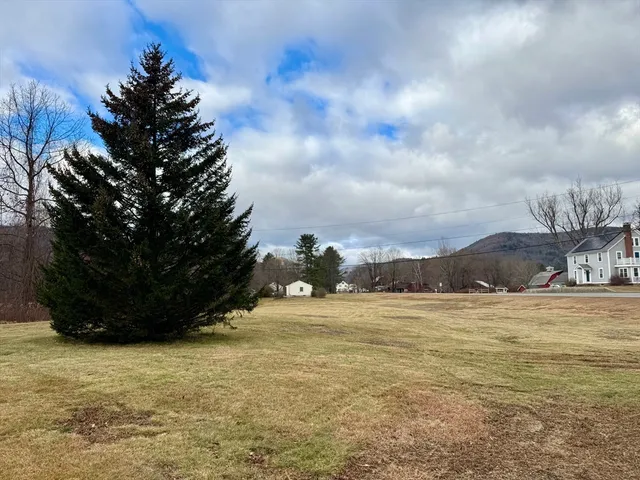 a view of ocean with a big yard