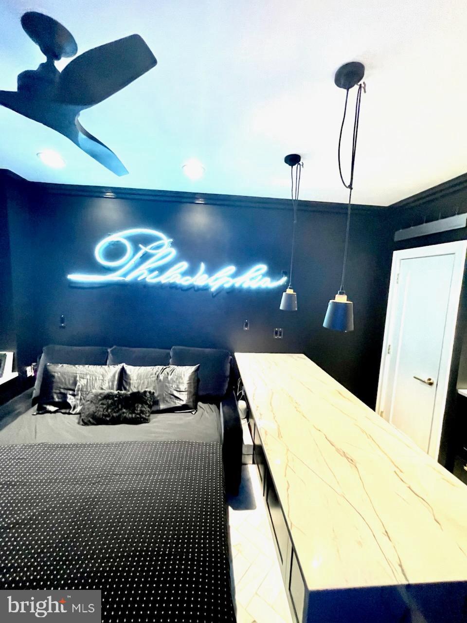 1324 Locust Street, Unit 429 Philadelphia, PA 19107 - Photo 11 of 23 a bedroom with a bed and a lamp