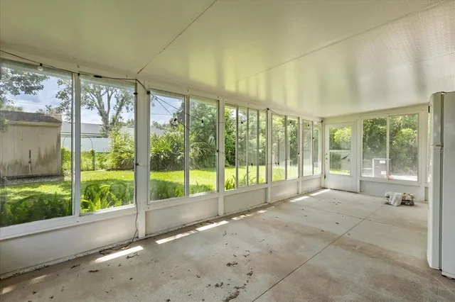a view of a house with a yard and garden