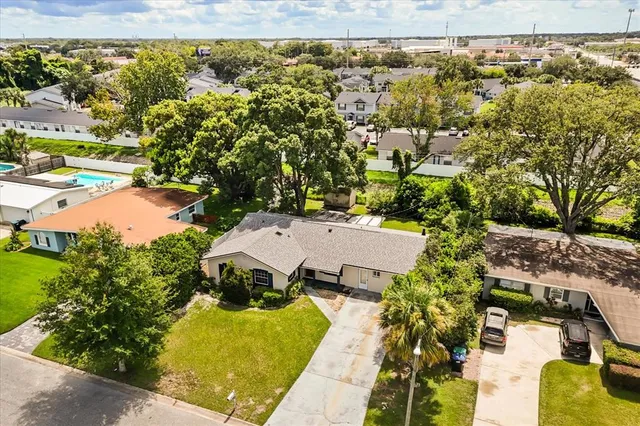 an aerial view of residential houses with outdoor space