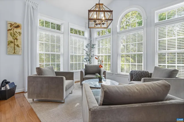 a kitchen with granite countertop a refrigerator and a stove top oven