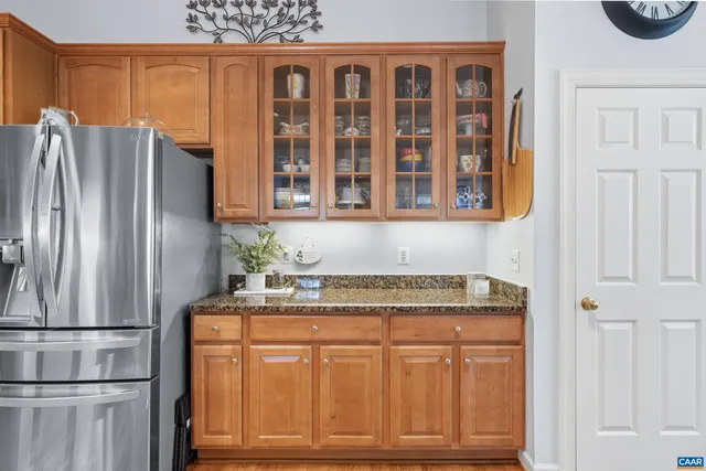 a bedroom with a bed and a television