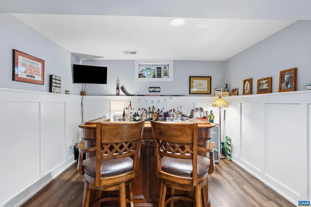 a bedroom with a bed and a desk